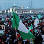 Nigeria @64: FG plans low-key celebration as Nigerian youths protest against hunger